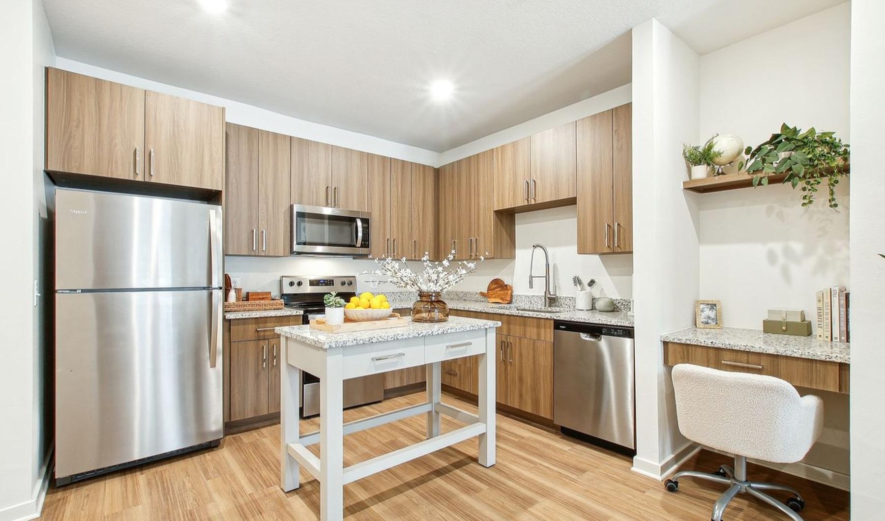 a kitchen with a table and chairs