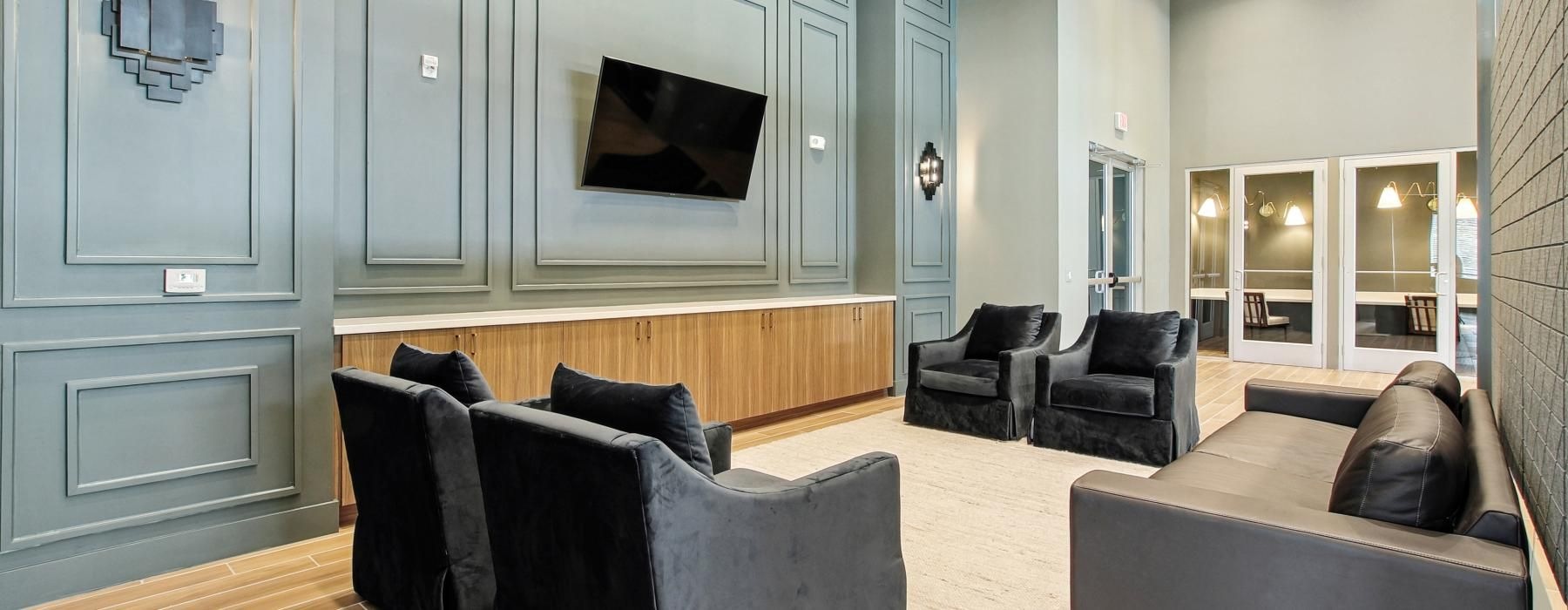 a living room with a couch and a tv