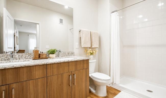 a bathroom with a tub toilet and sink