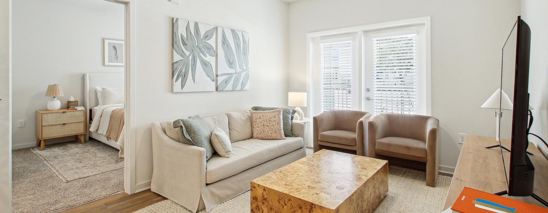 a living room with a couch and a table